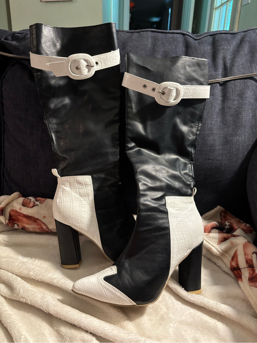 Black and white heeled boots